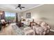 Comfortable living room with ceiling fan and balcony access at 1941 S Pierpont Dr # 2015, Mesa, AZ 85206