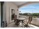 Cozy balcony with a wrought-iron table and chairs, offering scenic outdoor views at 1941 S Pierpont Dr # 2015, Mesa, AZ 85206