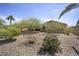 Beautiful backyard features desert landscaping with mature trees and shrubs for a private outdoor space at 19714 N Concord Dr, Surprise, AZ 85374