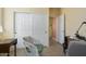 Bedroom showing a large closet, desk, and comfortable seating area at 19714 N Concord Dr, Surprise, AZ 85374