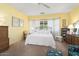 Comfortable bedroom with a ceiling fan and ample natural light at 19714 N Concord Dr, Surprise, AZ 85374