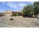 Charming desert home featuring low-maintenance landscaping and a covered front entrance at 19714 N Concord Dr, Surprise, AZ 85374