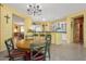 Bright kitchen showcasing breakfast bar seating and seamless access to the dining area at 19714 N Concord Dr, Surprise, AZ 85374
