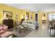 Cozy living room bathed in natural light features tile floors and comfortable furnishings at 19714 N Concord Dr, Surprise, AZ 85374