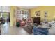 Charming living area features cozy seating, patterned drapes, and serene backyard views at 19714 N Concord Dr, Surprise, AZ 85374