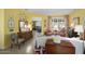 Sunlit living room with coordinated furnishings, tile floors, and bright yellow walls at 19714 N Concord Dr, Surprise, AZ 85374