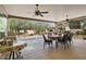 Spacious covered patio with dining and grilling area, with desert landscaping at 19714 N Concord Dr, Surprise, AZ 85374
