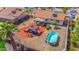 Aerial view of a spacious backyard with a pool, seating area, and landscaped features at 2009 W Calle Del Norte Dr, Chandler, AZ 85224