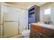Bathroom with shower-tub combo, dark vanity, and updated fixtures at 2009 W Calle Del Norte Dr, Chandler, AZ 85224