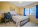 Cozy bedroom featuring a comfortable bed, natural light, and a tranquil atmosphere for relaxation at 2009 W Calle Del Norte Dr, Chandler, AZ 85224