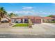 Charming single-story home with desert landscaping, tile roof, and a basketball hoop in driveway at 2009 W Calle Del Norte Dr, Chandler, AZ 85224