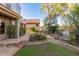 Expansive backyard featuring a built-in outdoor kitchen, lush landscaping, and a decorative fountain at 22063 N 77Th St, Scottsdale, AZ 85255