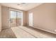 This bright bedroom features neutral tones, and a sliding glass door leading to an outdoor balcony at 22063 N 77Th St, Scottsdale, AZ 85255