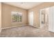 Spacious bedroom with lots of sunlight through the window and an attached bathroom at 22063 N 77Th St, Scottsdale, AZ 85255