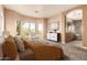 Primary bedroom with attached bathroom, large windows, neutral paint, and carpet at 22063 N 77Th St, Scottsdale, AZ 85255