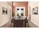 Elegant dining room with a modern table set, and neutral decor with high ceilings at 22063 N 77Th St, Scottsdale, AZ 85255