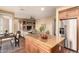Open concept kitchen with stainless steel appliances, granite countertops, and view to the living room at 22063 N 77Th St, Scottsdale, AZ 85255