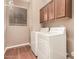 Laundry room with cabinets, neutral paint, and washer/dryer at 22063 N 77Th St, Scottsdale, AZ 85255