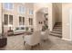 Bright living room showcasing high ceilings, neutral decor, and seamless indoor-outdoor flow at 22063 N 77Th St, Scottsdale, AZ 85255