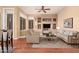 Bright living room with built-in shelving, modern furnishings, and wood flooring at 22063 N 77Th St, Scottsdale, AZ 85255