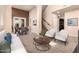 Open-concept living space with plush carpeting, stylish furniture, and abundant natural light at 22063 N 77Th St, Scottsdale, AZ 85255