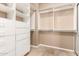 Bright walk-in closet featuring custom shelves, drawers, and ample storage space at 22063 N 77Th St, Scottsdale, AZ 85255