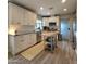 Updated kitchen boasts sleek stainless steel appliances, white cabinetry, and granite countertops at 2246 E Yale St, Phoenix, AZ 85006
