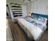 Stylish bedroom with an accent wall, integrated shoe rack, and a light and airy feel at 2246 E Yale St, Phoenix, AZ 85006
