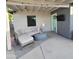 Cozy covered patio with comfortable seating, stylish decor, and a mounted TV for outdoor enjoyment at 2246 E Yale St, Phoenix, AZ 85006