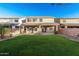 Spacious backyard with lush lawn and covered patio, ideal for outdoor enjoyment at 22500 N Greenland Park Dr, Maricopa, AZ 85139