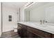 Bathroom featuring double sinks and white tile walls at 22500 N Greenland Park Dr, Maricopa, AZ 85139