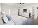 Bright bedroom featuring a ceiling fan, TV, and stylish white cabinet at 22500 N Greenland Park Dr, Maricopa, AZ 85139