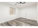 Bedroom featuring a ceiling fan, wood-look floors, and a closet at 22500 N Greenland Park Dr, Maricopa, AZ 85139