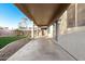 Spacious covered patio with concrete flooring and easy access to the backyard at 22500 N Greenland Park Dr, Maricopa, AZ 85139