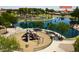 Overhead view of the community playground, adjacent to the park pond at 22500 N Greenland Park Dr, Maricopa, AZ 85139