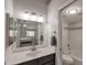 Clean bathroom with a large mirror, vanity, and a combined tub and shower at 2301 E University Dr # 256, Mesa, AZ 85213