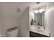 Bright half bathroom featuring a clean white vanity, mirror, and well-lit space for everyday convenience at 2301 E University Dr # 256, Mesa, AZ 85213