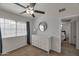 Tranquil bedroom features a dresser, window, and ceiling fan, perfect for relaxing and unwinding at 2301 E University Dr # 256, Mesa, AZ 85213