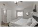 Bright bedroom with a large window, ceiling fan, and a neutral color palette at 2301 E University Dr # 256, Mesa, AZ 85213