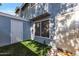 Inviting townhome exterior featuring a small green space and security door for added safety and curb appeal at 2301 E University Dr # 256, Mesa, AZ 85213