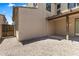Backyard with stone groundcover and covered patio at 2363 W Dusty Wren Dr, Phoenix, AZ 85085