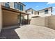 Backyard featuring stone groundcover, a block wall, and a covered patio at 2363 W Dusty Wren Dr, Phoenix, AZ 85085