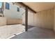 A simple backyard with patio cover, featuring a gravel yard and block wall at 2363 W Dusty Wren Dr, Phoenix, AZ 85085