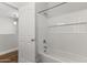 Clean bathroom featuring a tiled shower and a full-size bathtub at 2363 W Dusty Wren Dr, Phoenix, AZ 85085
