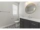 Stylish bathroom showcasing modern vanity, decorative floor tiles, and chrome fixtures at 2363 W Dusty Wren Dr, Phoenix, AZ 85085