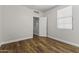 A bedroom featuring hardwood floors and neutral walls, offering a modern feel at 2363 W Dusty Wren Dr, Phoenix, AZ 85085