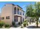 Attractive two-story home featuring a balcony, complemented by well-manicured landscaping and a sidewalk at 2363 W Dusty Wren Dr, Phoenix, AZ 85085