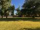 Expansive backyard featuring mature trees and a fenced pasture, perfect for outdoor activities at 25722 S 179Th St, Queen Creek, AZ 85142