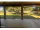 Backyard view showcasing the expansive green space, mature trees and covered patio at 25722 S 179Th St, Queen Creek, AZ 85142