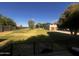 Expansive backyard with lush grass and mature trees, perfect for outdoor activities at 25722 S 179Th St, Queen Creek, AZ 85142